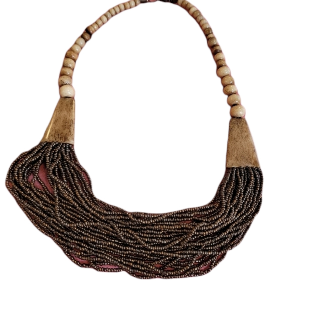 Brown seabeed necklace, wooden beads at top.